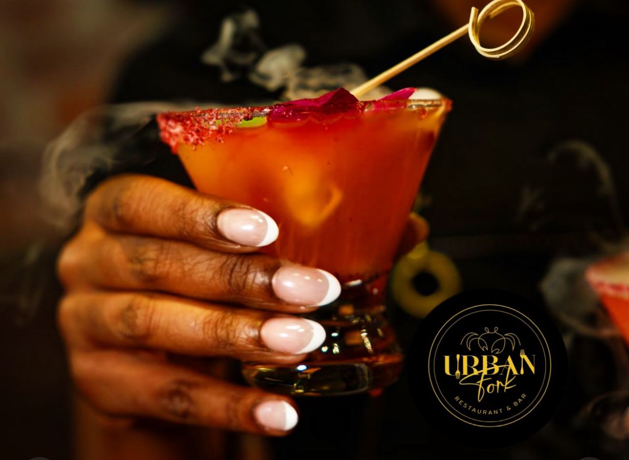 A smoking signature cocktail with a sugared rim
